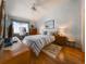 Relaxing main bedroom with a ceiling fan, picture window, and coordinated decor at 39650 Us Hwy 19 N, Tarpon Springs, FL 34689