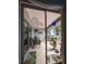 Enclosed porch area with furniture and plants, providing a relaxing and inviting outdoor space at 39650 Us Hwy 19 N, Tarpon Springs, FL 34689