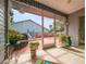 Relaxing screened patio with potted plants and tile floors, perfect for enjoying the outdoors at 39650 Us Hwy 19 N, Tarpon Springs, FL 34689