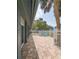 Back patio area featuring brick pavers and a view of the community at 39650 Us Hwy 19 N, Tarpon Springs, FL 34689