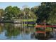Scenic waterfront featuring a dock and lush greenery, offering serene views and recreational access at 39650 Us Hwy 19 N, Tarpon Springs, FL 34689