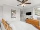 Relaxing bedroom with a queen-sized bed, Casablanca poster, and a ceiling fan to keep you comfortable at 400 E Jean St, Tampa, FL 33604