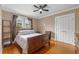 Bedroom features hardwood floors, a ceiling fan, and a closet at 400 E Jean St, Tampa, FL 33604