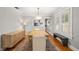 Formal dining room featuring wood floors, decorative light fixture, and large windows at 400 E Jean St, Tampa, FL 33604