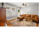 Living room with hardwood floors, a leather sofa, and a glass coffee table at 400 E Jean St, Tampa, FL 33604