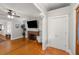 Open living room featuring wood floors, fireplace, and closet at 400 E Jean St, Tampa, FL 33604