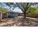 Home's expansive backyard features mature trees and a patio, great for outdoor entertaining at 4418 Pine Meadow Ct, Tampa, FL 33624