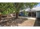 Large backyard offers privacy with a wood fence and mature trees at 4418 Pine Meadow Ct, Tampa, FL 33624
