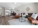 Open-concept living area with vaulted ceilings, luxury vinyl plank floors, and modern decor at 4418 Pine Meadow Ct, Tampa, FL 33624