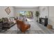 Comfortable living area featuring new floors, neutral paint, and sliding glass doors to the backyard at 4418 Pine Meadow Ct, Tampa, FL 33624