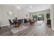 Bright and airy living and dining space featuring an open layout and modern decor at 4418 Pine Meadow Ct, Tampa, FL 33624