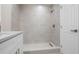 Modern bathroom features tiled shower with glass door and updated fixtures at 4418 Pine Meadow Ct, Tampa, FL 33624
