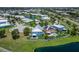 Inviting home with a pool, lush landscaping, and a white picket fence in a friendly community at 449 Bahama Grande Blvd, Apollo Beach, FL 33572