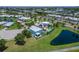 Beautiful waterfront property with lush landscaping and a pool in a quiet lakeside community at 449 Bahama Grande Blvd, Apollo Beach, FL 33572