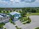 Aerial view of home with lush landscaping, solar panels, and community amenities at 449 Bahama Grande Blvd, Apollo Beach, FL 33572