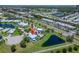 Charming home with a pool, lush landscaping and solar panels nestled in a tranquil lakeside community at 449 Bahama Grande Blvd, Apollo Beach, FL 33572