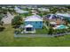 Desirable home features backyard with screened patio and white fence overlooking lush green space in a beautiful community at 449 Bahama Grande Blvd, Apollo Beach, FL 33572