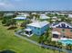 Desirable home features backyard with screened patio and white fence overlooking lush green space in a beautiful community at 449 Bahama Grande Blvd, Apollo Beach, FL 33572