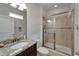 Bathroom featuring a granite vanity and glass enclosed shower at 449 Bahama Grande Blvd, Apollo Beach, FL 33572
