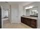 Hallway view into bathroom with granite countertop and views into the hall and main bedroom at 449 Bahama Grande Blvd, Apollo Beach, FL 33572
