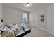 Bedroom featuring neutral decor, one window, carpeted floors and closet at 449 Bahama Grande Blvd, Apollo Beach, FL 33572