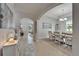 Open-concept dining room with tile flooring, stylish chandelier, and plenty of natural light at 449 Bahama Grande Blvd, Apollo Beach, FL 33572