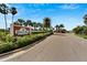A welcoming entrance sign announces 'Bimini Bay, A Casual Coastal Community' with lush landscaping at 449 Bahama Grande Blvd, Apollo Beach, FL 33572