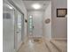 Bright foyer with tile flooring, a front door with glass inserts, and staircase access at 449 Bahama Grande Blvd, Apollo Beach, FL 33572