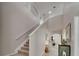 Open foyer featuring high ceilings, staircase, and decorative accents leading to the main living spaces at 449 Bahama Grande Blvd, Apollo Beach, FL 33572