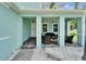 Inviting front porch with comfortable seating, offering a relaxing outdoor space at 449 Bahama Grande Blvd, Apollo Beach, FL 33572
