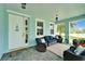 Charming front porch with cozy seating, nautical decor, and a welcoming entrance at 449 Bahama Grande Blvd, Apollo Beach, FL 33572