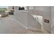 Open hallway design showcasing the staircase and living space with neutral walls and plush carpeting at 449 Bahama Grande Blvd, Apollo Beach, FL 33572