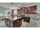 Beautiful kitchen features granite countertops, stainless steel appliances, and a spacious island perfect for entertaining at 449 Bahama Grande Blvd, Apollo Beach, FL 33572