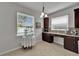 Bright dining nook with natural light and modern cabinetry is the ideal space for enjoying morning coffee and conversation at 449 Bahama Grande Blvd, Apollo Beach, FL 33572
