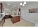Open kitchen flows seamlessly into the adjacent living area, perfect for hosting gatherings and creating memories at 449 Bahama Grande Blvd, Apollo Beach, FL 33572
