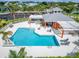 A sparkling blue community pool with lounge seating offers a resort-style experience for residents at 449 Bahama Grande Blvd, Apollo Beach, FL 33572