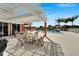 Community pool with lounge chairs and a covered seating area provides a relaxing spot for residents at 449 Bahama Grande Blvd, Apollo Beach, FL 33572