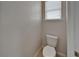 Toilet room featuring neutral decor, tile floor and one window for natural light at 449 Bahama Grande Blvd, Apollo Beach, FL 33572