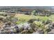Aerial shot showcasing the golf course, clubhouse, and surrounding landscape with water features at 5029 Camberley Ln, Oldsmar, FL 34677