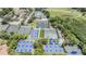 An aerial view of the community tennis and pickleball courts, pool, and clubhouse for an active lifestyle at 5029 Camberley Ln, Oldsmar, FL 34677