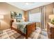 Comfortable bedroom featuring a ceiling fan, a bright window and neutral decor at 5029 Camberley Ln, Oldsmar, FL 34677
