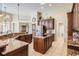 Spacious kitchen featuring tile flooring, granite countertops, stainless steel appliances, and abundant storage space at 5029 Camberley Ln, Oldsmar, FL 34677