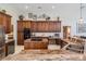 Spacious kitchen with custom wood cabinets, granite countertops, and stainless-steel appliances at 5029 Camberley Ln, Oldsmar, FL 34677