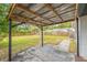 Covered patio overlooking a large, green, fenced backyard at 5622 Tangerine S Ave, Gulfport, FL 33707
