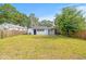 Fenced backyard with lush grass and covered patio area at 5622 Tangerine S Ave, Gulfport, FL 33707