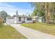 Charming home with well-manicured lawn and long driveway at 5622 Tangerine S Ave, Gulfport, FL 33707