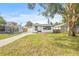 Charming single-story home with a well-manicured lawn and inviting curb appeal on a sunny day at 5622 Tangerine S Ave, Gulfport, FL 33707
