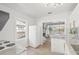 Bright kitchen features stainless appliances, light countertops and wood floors at 5622 Tangerine S Ave, Gulfport, FL 33707