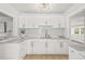 Spacious kitchen features ample cabinetry and stone countertops at 5622 Tangerine S Ave, Gulfport, FL 33707