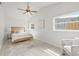 Bright main bedroom with large windows and ceiling fan at 5622 Tangerine S Ave, Gulfport, FL 33707